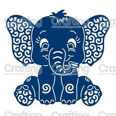 an elephant with swirls on it's trunk and ears, sitting in front of a