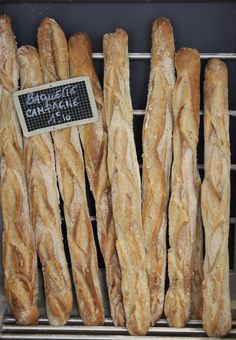 bread sticks are lined up on a rack