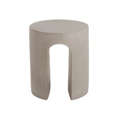 a white stool with an arch shaped design on the front and back legs, made out of concrete