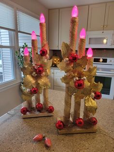 two candles that are sitting on top of a counter