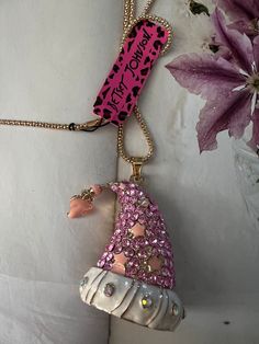 PLEASE READ! Hello  I love shopping estate sales. Found this necklace here in San Diego . It is tagged betsey Johnson but I don't see a Betsey Johnson logo on the actual necklace. I can't say for sure if this is an authentic bj necklace or not . I'm pricing this at only $24. Cute wizards hat or Santa hat in pink and goldtone. No missing stones very nice condition.Sold as is please see all pictures. Free shipping Adjustable Pink Holiday Jewelry, Adjustable Pink Jewelry For Holiday, Pink Adjustable Christmas Jewelry, Whimsical Pendant Jewelry For Party, Handmade Pink Jewelry For Christmas, Handmade Pink Jewelry For Holiday, Whimsical Pink Pendant Charm Necklace, Pink Christmas Party Jewelry, Wizards Hat