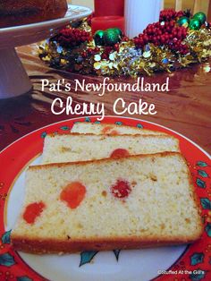 two pieces of cake sitting on top of a red and white plate with the words pat's newfoundland cherry cake