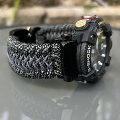 "Handcrafted with 100% Nylon Paracord \"MADE IN USA\".   Our Products include:    ➖Custom handcrafted watch bands \"According to You\". No matter how small or big your wrist size, we will craft your perfect fitting band (wrist size picture measurement required).  ➖Variety of styles to choose from. You may order your band \"As pictured\", or feel free to request changes. If you don't see your favorite style in our page or watch category yet, please contact us and we can discuss your options.  ➖Variety of buckles or clasps (Prices may vary).  ➖FREE FIRST CLASS USPS SHIPPING FOR DOMESTIC U.S. ORDERS (Includes U.S. Military APO/FPO Address Overseas).  Please, refer to policies for handcrafting time frames https://www.etsy.com/shop/Cording2U#policies. These may vary month to month depending on Paracord Watch, Personalized Watch, Casio G Shock Watches, Handmade Watch Bands, Personalized Watches, Handmade Watch, Spring Valley, Veteran Owned Business, G Shock Watches