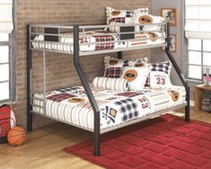 a bunk bed in a room with brick walls and hardwood floors, along with a red rug on the floor