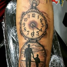 a man with a tattoo on his arm holding the hand of a child in a pocket watch