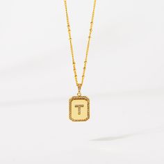 Timeless, elegant, and classy - our gold initial pendant necklace gives a personal touch to any outfit. This 18-20" personalized necklace features a gold pendant with an initial that is framed by shimmering crystals and the empowering message “I am Beautiful, Resilient, Strong, Enough, Loved ”is delicately engraved on the back. Tough days don't stand a chance against your inner fire! Wear this gold initial necklace to remind yourself that you are beautiful, loved, enough, strong, and resilient t Classic Tan Initial Pendant Necklace, Elegant Initial Pendant Necklace With Letter Beads, Gold Initial Pendant Necklace With Name, Elegant Tan Monogram Initial Necklace, Elegant Gold Letter Bead Necklaces, Gold Elegant Necklaces With Letter Beads, Elegant Gold Necklaces With Letter Beads, Gold Anniversary Letter Beads Necklace, Elegant Personalized Tan Initial Necklace