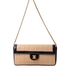 This Is An Authentic Chanel Patent Lambskin East West Chocolate Bar Flap Beige. This Chic Shoulder Bag Is Beautifully Crafted Of Beige Square Quilted Lambskin Leather. The Bag Features A Gold Shoulder Chain Threaded With Beige Leather, A Short Frontal Flap With Black Patent Leather Trim And A Mademoiselle Turn Lock. This Opens To A Matching Leather Interior With Patch Pockets. This Is A Marvelous Shoulder Bag For Just The Essentials From Chanel! Sale Includes Original Chanel Authenticity Card And Dustbag. Length: 10.00 In Width: 2.00 In Height: 5.00 In Drop: 13.00 In Condition: Great Condition. Minor Signs Of Use Present, Leather Creasing, Minor Stains, Scratches. Please Refer To All Photos Chanel Woc, Chanel Crossbody, Chanel Tote, Chanel Wallet, Shoulder Chain, Black Patent Leather, Black Cream, Flap Bag, Lambskin Leather