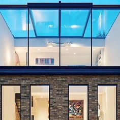 an image of a modern house with glass walls