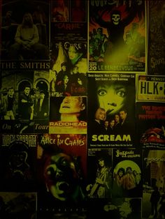 a wall covered in posters and movies