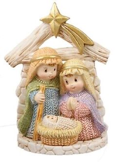 a nativity figurine with a star above it