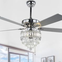 a ceiling fan with crystal chandelier hanging from it