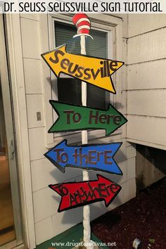 the dr seusssville sign is on display in front of a door with several arrows pointing to different locations