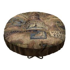 a round foot stool covered in fabric