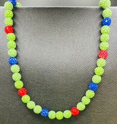 "**PLEASE be sure of the necklace length that will work for you before ordering as each of these are made to order! **Youth necklaces are approximately 16\" - 20\" (see photo in listing of my 9 year old son wearing a 16\"). **MOST adults order at least the 20\" (or more) necklace. Adult sizes can be made in 16\", 18\", 20\",22\" and 24\". If you need a custom size - please let me know.  Please make sure you order the correct size as each neckace is made to order!! Custom orders/colors available!  These necklaces are hand crafted in Florida, with grade A rhinestone polymer clay beads, durable and flexible beading wire and a lobster clasp. These are very glitzy, blingy and beautiful!  Please let me know which colors you would like in the pattern you would like. For example- 1 blue, 3 white, Green Round Beaded Necklaces For Party, Adjustable Green Beaded Necklaces, Green Round Beaded Necklace With Adjustable Fit, Phillies Bracelet, Cheap Patriotic Beaded Necklaces, Patriotic Blue Beaded Necklaces, Red White And Blue Necklace, Baseball Chain Necklaces, Baseball Necklace