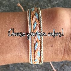 a woman's arm with two different colored bracelets on it and the words choose your own colors