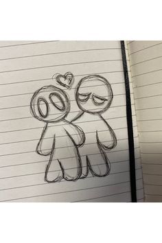 an open notebook with a drawing of two people holding each other's arms and smiling