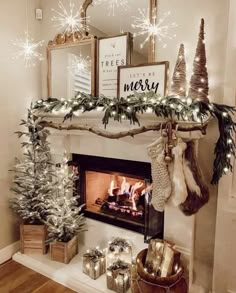 a fireplace decorated for christmas with stockings and garland on the mantel above it is a merry message