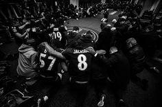 a group of people sitting around each other on the floor