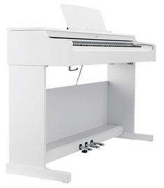 a white piano sitting on top of a table