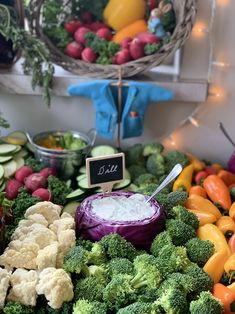 an assortment of vegetables and dips on display