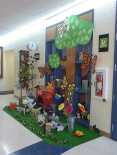 a school hallway decorated with paper animals and trees