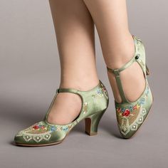 As hemlines rose in the 1920s, flashy footwear was all the rage, and the Daisy Embroidered T-Strap heels are just the ticket. Made in luminous satin heavily embroidered in a gorgeous botanical design, the Daisy T-Strap Shoes are closely based on an original pair in Bata Shoe Museum. These gorgeous shoes are accurate for the 1920s, 1930s, and 1940s, and offer our refined and stable 2.5 in / 6.3 cm Spanish heel paired with open sides and an almond toe. Wear Daisy embroidered 1920s shoes with any g Whimsical Shoes, Bata Shoes, 1920s Shoes, American Duchess, T Strap Shoes, T Strap Heels, Embroidered Shoes, Botanical Design, Fabric Shoes