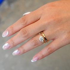 In one fell swoop, Jennie Kwon has found a way to combine round, baguette, and trillion cut white diamonds into one impossibly dainty ring. Those looking for a classic solitaire silhouette with just a touch of geometrical intrigue will fall madly in love. Made in the U.S.A. All sizes made to order within 3-4 weeks of p Jennie Kwon, Madly In Love, Simple Beauty, Dainty Ring, Gold Set, White Diamonds, 1 Carat, Stacking Rings, Bezel Setting