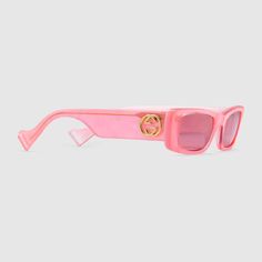 Shop the Rectangular sunglasses by Gucci. Reminiscent of the nineties' coveted shapes and colours, the rectangular sunglasses are presented in a series of fluorescent hues. An eclectic play of contrasting layers, the pink acetate frame and temples are backed by white acetate with a mother of pearl effect. Gucci Rectangular Sunglasses, Rectangle Frame Sunglasses, Lux Fashion, Trendy Sunglasses