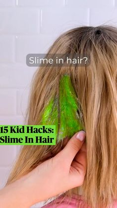 a woman is drying her hair with green leaves on it and a blue water bottle in the background