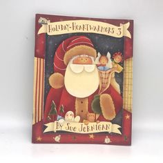 a children's book with santa claus and other christmas related items on the cover