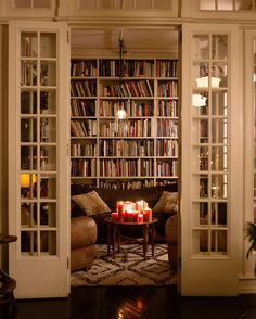 a living room filled with lots of books