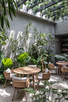 an outdoor dining area with tables and chairs