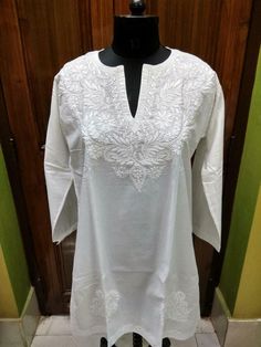 BEAUTIFUL 100% COTTON RARE TUNIC SHIRT ETHNIC CHIKAN HANDMADE EMBROIDERY TOP KURTA KURTI FREE SHIP COUNTRY OF MANUFACTURE INDIA MAKER  KINSLEY KRAFT   FEATURES WE ARE EXPORTERS OF ALL KINDS FASHION EXCLUSIVE ETHNIC GARMENTS GREAT PRICES GREAT CHOICE FOR ALL WITH FANCY CHIKAN EMBROIDERY * 100% Fancy Hand Embroidered CHIKAN work is only done in our town Lucknow, India. From our town this artwork is sent to the world.  All my Items are Made in a pet free and smoke free environment.   At "KINSLEY KR Chikan Tops Cotton, Traditional V-neck Top With Chikankari Embroidery, Traditional V-neck Kurta With Self Design, Traditional Cotton V-neck Kurta, White Long Sleeve Blouse With Chikankari Embroidery, Traditional V-neck Kurta With Chikankari Embroidery, Traditional V-neck Tops With Intricate Embroidery, Traditional Short Sleeve Kurta With Floral Embroidery, Cotton V-neck Kurta With Chikankari Embroidery