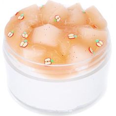 a clear container filled with lots of ice and watermelon slices on top of it