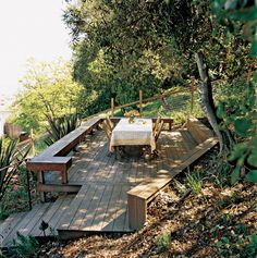 a table and benches on a wooden deck