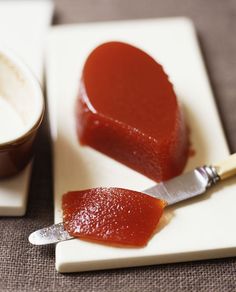 two pieces of cake on a plate with a knife