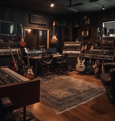 a room filled with guitars and other musical equipment