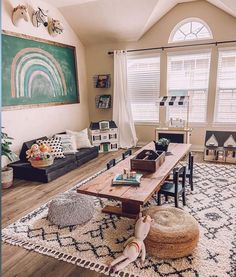 a living room filled with furniture and a rug