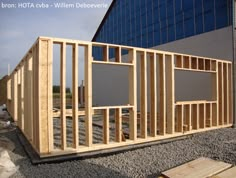 a building being built with wooden framing and windows