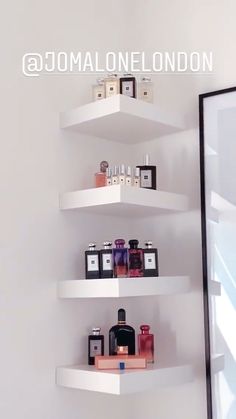 the corner shelves have perfumes on them