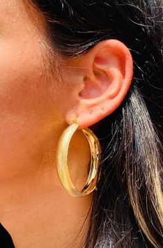 18kt Gold Filled Chunky Lightweight Ridged Hoops. The perfect bold pair to make a statement with. Hoop Size: 55mm Width: 10mm Clasp: Hinged  Material: 18 Karat Gold Filled, Hypoallergenic. Tarnish Resistant. Gold-filled does not de-laminate or peel like Gold plated Jewelry nor does it tarnish as readily as silver. Generally speaking, gold filled is better quality and will have a much longer lasting color than plated jewelry. We recommend keeping abrasive chemicals away from the jewelry for the i Chunky Hoops Earrings, Thick Gold Hoops, Big Hoop Earrings, Gold Filled Hoops, Hoops Earrings, Alessandra Ambrosio, Vanessa Hudgens, Jessica Alba, Large Earrings