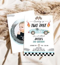 two fast cars birthday party invitations on a bed with white sheets and brown fur