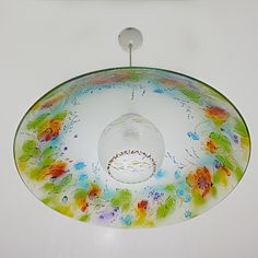 a colorful glass bowl hanging from the ceiling