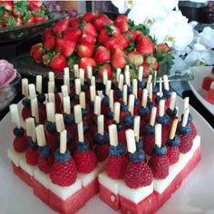 strawberries, raspberries and blueberries are arranged in the shape of hearts