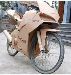 an unusual looking bike made out of cardboard