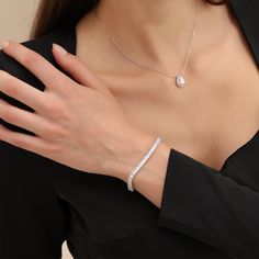 Elevate your style with this exquisite tennis bracelet. Crafted with precision, this stunning piece features a line of sparkling radiant-cut gemstones, each expertly set in a delicate and timeless design. The brilliant facets of the gemstones catch the light, creating a mesmerizing display of elegance and luxury.Carat Weight: 10.05 ctStone Size: 3*3 mmStone Type: Moissanite/GemstoneNumber of Stones: 67 Stone Color: OptionalStone Shape: RadiantWidth: 4 mmThickness: 2.9 mmMaterial: 10K/14K/18K Sol Elegant Sparkling Diamond Bracelet For Anniversary, Elegant Sparkling Tennis Bracelet For Anniversary, Elegant Sparkling Diamond Bracelet As Gift, Elegant Sparkling Diamond Bracelet, Elegant White Gold Sparkling Diamond Bracelet, Sparkling Diamond Tennis Bracelet, Sparkling Diamond Tennis Bracelet In Fine Jewelry Style, Elegant Diamond Tennis Bracelet With Sparkling Detail, Diamond Tennis Bracelet With Baguette Cut