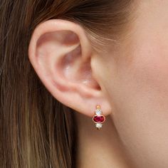 An ideal choice for mixing and matching, these huggie earrings showcase beautiful oval shaped rubies accented by a pair of sparkling oval diamonds each framed within a thin bezel for a contemporary appearance. These modern day heirlooms are comfortable and lightweight so that they can be worn and enjoyed with ease. Metal: 18kt Gold Ruby Weight: 1.25 ct. Diamond Weight: 0.37 ct. Measurements: 15.0 mm length *Please note that the listed ct. weights are approximate and may be subject to slight vari Diamond Huggie Earrings, Red Spinel, Rubellite Tourmaline, Red Gemstones, Huggie Earrings, Oval Diamond, Three Stone, Huggies Earrings, Pure Color