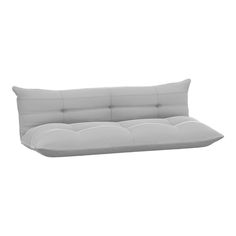 a white couch sitting on top of a white floor