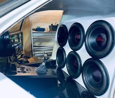 the inside of a car with some speakers on it