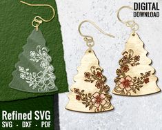 wooden christmas tree earrings with floral designs on them